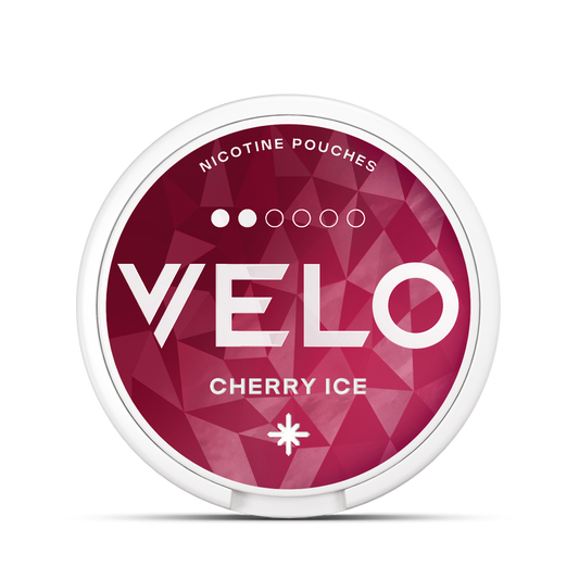 A round container labeled "VELO" featuring "Nicotine Pouches" with "Cherry Ice" in white text, set against a red geometric pattern background.