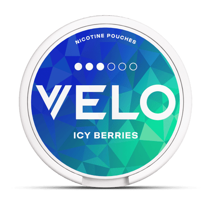 A round container labeled "VELO" with "NICOTINE POUCHES" and "ICY BERRIES" in white text, featuring a geometric blue and green background.